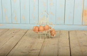 https://images.esellerpro.com/2278/I/137/582/CH010-helter-skelter-design-egg-rack-storage-holder-cream-2.jpg
